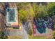 Aerial view showcases the community pool and tennis courts with convenient parking at 5494 Princeton Oaks Ln, Sugar Hill, GA 30518