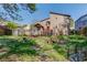 Beautiful backyard with a small bridge, a patio, and lush landscaping at 5494 Princeton Oaks Ln, Sugar Hill, GA 30518
