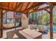 Outdoor entertainment space featuring an in-ground pool, hot tub, and covered patio at 5494 Princeton Oaks Ln, Sugar Hill, GA 30518