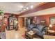 Basement with futon, tile floor, storage cabinet and wooden door at 5494 Princeton Oaks Ln, Sugar Hill, GA 30518