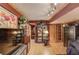 Basement with large TV, wooden display cases and wooden doors at 5494 Princeton Oaks Ln, Sugar Hill, GA 30518