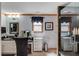 Elegant bathroom featuring black granite countertops, modern fixtures, and a glass enclosed shower at 5494 Princeton Oaks Ln, Sugar Hill, GA 30518