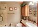 Bathroom with granite sink, glass shower and neutral-toned walls at 5494 Princeton Oaks Ln, Sugar Hill, GA 30518