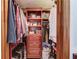 Walk-in closet with shelving, hanging rods, and drawers for organized storage at 5494 Princeton Oaks Ln, Sugar Hill, GA 30518