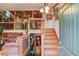 Foyer with staircase, hardwood floors, and access to both upper and lower levels at 5494 Princeton Oaks Ln, Sugar Hill, GA 30518
