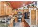 Charming kitchen featuring granite countertops, wood cabinetry, and modern appliances at 5494 Princeton Oaks Ln, Sugar Hill, GA 30518