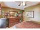 Main bedroom with wooden accents, olive walls and a view to other rooms at 5494 Princeton Oaks Ln, Sugar Hill, GA 30518