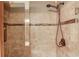 Close-up of shower showcasing tile work and bronze fixtures at 5494 Princeton Oaks Ln, Sugar Hill, GA 30518