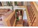 Staircase with wooden railings and view of the home's interior at 5494 Princeton Oaks Ln, Sugar Hill, GA 30518
