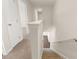View of staircase with carpeted stairs and white banister at 8229 Coldstream Dr, Fairburn, GA 30213