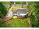 Aerial view of a home's backyard featuring a deck with furniture, a well-maintained lawn, and a surrounding fence at 240 Pinebrook Way, Roswell, GA 30076