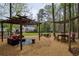 Expansive backyard featuring multiple outdoor living spaces including seating, dining, and a hammock area at 240 Pinebrook Way, Roswell, GA 30076