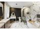 Lavish bathroom features a vanity with makeup table, toilet, marble tiled glass shower, and soaking tub at 240 Pinebrook Way, Roswell, GA 30076