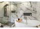 Bright bathroom features glass enclosed shower with sleek fixtures and a luxurious soaking tub at 240 Pinebrook Way, Roswell, GA 30076