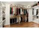 Spacious walk-in closet with custom shelving and hanging rods for optimal organization at 240 Pinebrook Way, Roswell, GA 30076