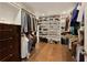 Walk-in closet with built-in shelving and ample storage space for shoes and clothing at 240 Pinebrook Way, Roswell, GA 30076