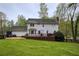 Charming two-story house with a well-maintained backyard and wooden deck, perfect for entertaining at 240 Pinebrook Way, Roswell, GA 30076