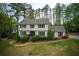 Charming two-story home featuring a well-manicured lawn, mature landscaping, and a welcoming front entrance at 240 Pinebrook Way, Roswell, GA 30076