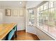 Eat-in kitchen area with large windows overlooking deck with seating and butcher block island with seating at 240 Pinebrook Way, Roswell, GA 30076