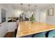Modern kitchen with a spacious island, white cabinets, stainless steel appliances, and stylish lighting for a contemporary feel at 240 Pinebrook Way, Roswell, GA 30076