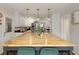 Beautiful kitchen featuring a large island, white cabinets, and stainless steel appliances, perfect for cooking and entertaining at 240 Pinebrook Way, Roswell, GA 30076