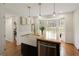 Open kitchen featuring butcher block island, farmhouse sink, stainless dishwasher, and breakfast nook at 240 Pinebrook Way, Roswell, GA 30076
