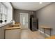 A modern kitchen featuring a stainless steel refrigerator, sink with butcher block counters, and ample natural light at 240 Pinebrook Way, Roswell, GA 30076