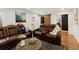 This cozy living room features theater seating, fireplace, and access to backyard at 240 Pinebrook Way, Roswell, GA 30076