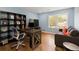 Office with modern desk, shelving, comfortable seating, and natural light at 240 Pinebrook Way, Roswell, GA 30076