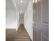 Bright entryway with hardwood floors and neutral paint, creating a welcoming and modern space at 8227 Coldstream Dr, Fairburn, GA 30213