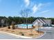 Community pool with a clubhouse, parking and landscaping at 8227 Coldstream Dr, Fairburn, GA 30213