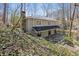Beautiful backyard featuring a deck and private, wooded views at 7127 Riverside Dr, Atlanta, GA 30328