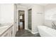 Beautiful bathroom boasting a tub and shower with tile surround at 7127 Riverside Dr, Atlanta, GA 30328