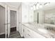 Bright bathroom featuring dual vanity and a separate tub at 7127 Riverside Dr, Atlanta, GA 30328