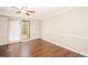 Bedroom with hardwood floors, ceiling fan, and natural light at 7127 Riverside Dr, Atlanta, GA 30328