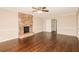 Spacious living room with wood floors and a striking stone fireplace at 7127 Riverside Dr, Atlanta, GA 30328