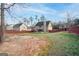 A spacious backyard features a large lawn area perfect for outdoor activities and entertaining at 5143 Olive Branch Cir, Powder Springs, GA 30127