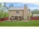 Spacious backyard with a patio area, perfect for outdoor entertaining and relaxation at 5143 Olive Branch Cir, Powder Springs, GA 30127