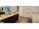 Bathroom with a granite countertop, and sink and decorative lighting at 5143 Olive Branch Cir, Powder Springs, GA 30127