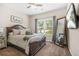Bedroom with a large bed, plush bedding, a full length mirror and a 
