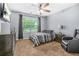 Comfortable bedroom with dresser, TV, side table, and leather reclining chair at 5143 Olive Branch Cir, Powder Springs, GA 30127