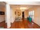 Elegant dining room with coffered ceilings, hardwood floors, and stylish lighting, perfect for entertaining at 5143 Olive Branch Cir, Powder Springs, GA 30127
