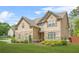 Charming home featuring a combination of stone and siding, complemented by a lush green lawn at 5143 Olive Branch Cir, Powder Springs, GA 30127