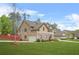 Two-story home featuring stone accents, attached garage, well-manicured lawn, and inviting curb appeal at 5143 Olive Branch Cir, Powder Springs, GA 30127
