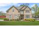 Charming two-story home with stone accents, well-manicured lawn, and inviting curb appeal at 5143 Olive Branch Cir, Powder Springs, GA 30127