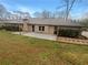 Spacious backyard with a patio area and ample green space, perfect for outdoor living at 724 Dukehart Ct, Stone Mountain, GA 30083