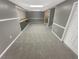 Large finished basement featuring neutral walls, carpet, and built-in cabinets at 724 Dukehart Ct, Stone Mountain, GA 30083