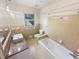 Bright bathroom featuring a tiled shower and tub combination and a large vanity at 724 Dukehart Ct, Stone Mountain, GA 30083
