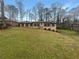 Charming single-story home featuring a well-maintained lawn and classic brick facade at 724 Dukehart Ct, Stone Mountain, GA 30083