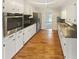 Well-lit kitchen boasts granite countertops, stainless steel appliances, and ample storage at 724 Dukehart Ct, Stone Mountain, GA 30083